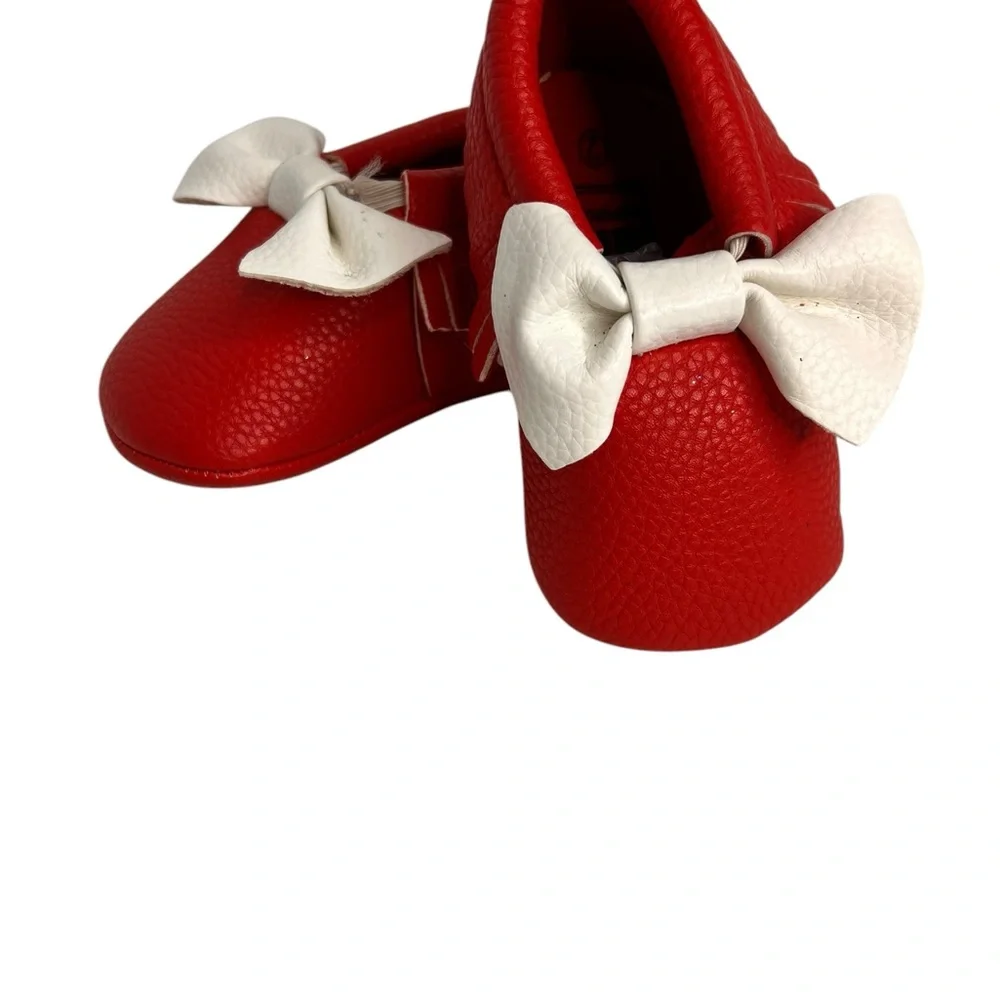 Red Romirus soft sole moccasins W/bow& Fringe